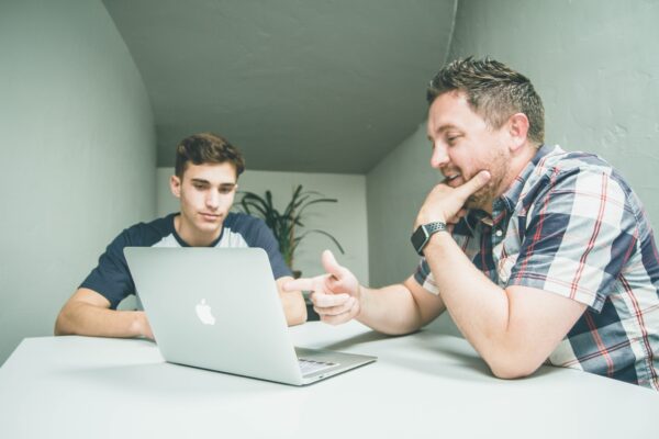 a man and boy at a computer