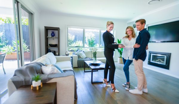 a couple making a real estate transaction in an apartment