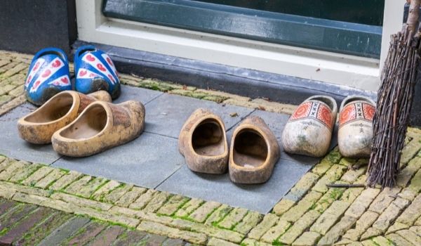 four pairs of klompen outside a front door