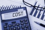 a calculator with the word "cost" on it