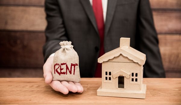 a man holding a visual comparison for renting a home in the netherlands