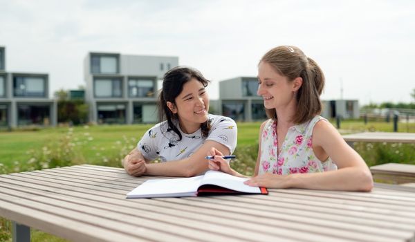 IB Tutor and student outside