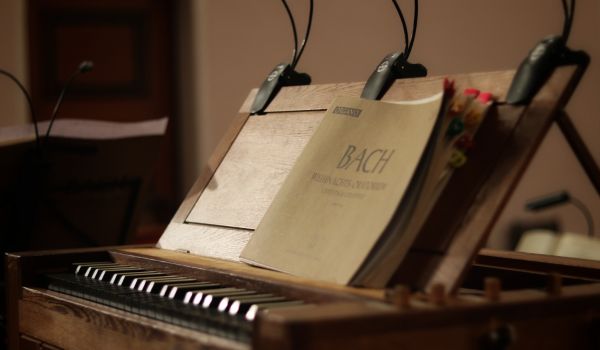 an old piano with back sheet music