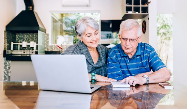 an elderly couple checking what changes have occurred to the Dutch Pension System in 2023