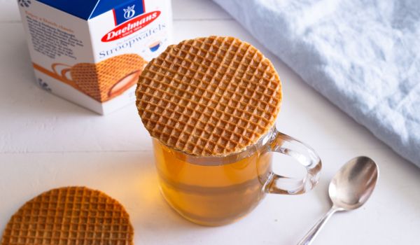 a stroopwafel resting on a hot cup of tea