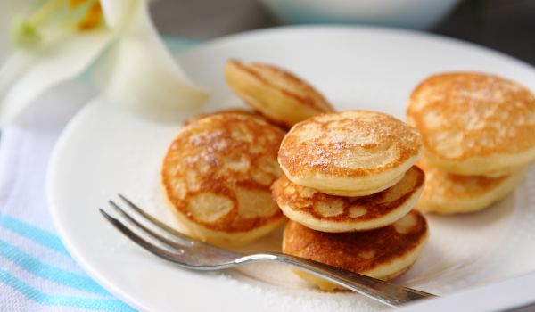 stacks of Poffertjes on a plate