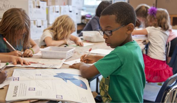 a young male student ina green shirt