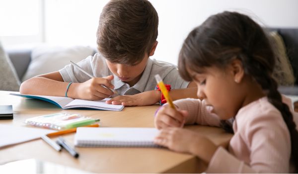 two young students doing homework