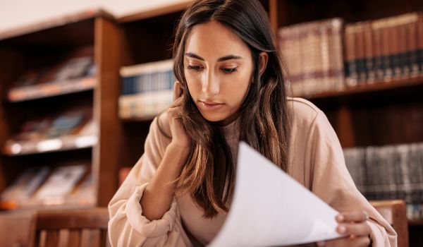 a college student studying in the library