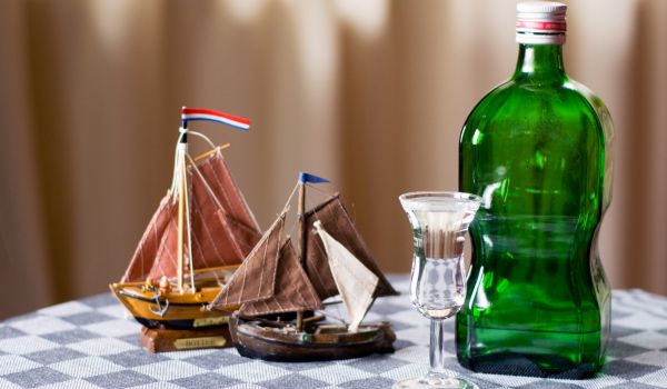 two little boats next two a bottle and glass od dutch jenever