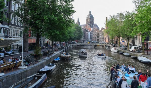 several boats on an amsterdam canal