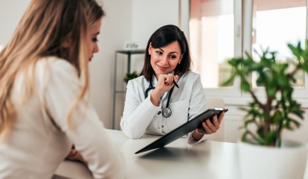 Smiling doctor consulting her patient