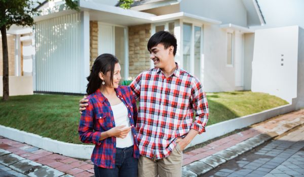 a happy couple in the Netherlands after paying transfer tax on their new home