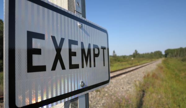 a large street sign that says exempt