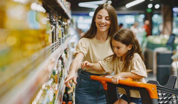 a mother and daughter at the supermarket