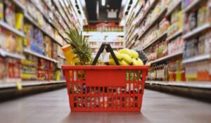 grocery shopping basket on the floor of a supermarket