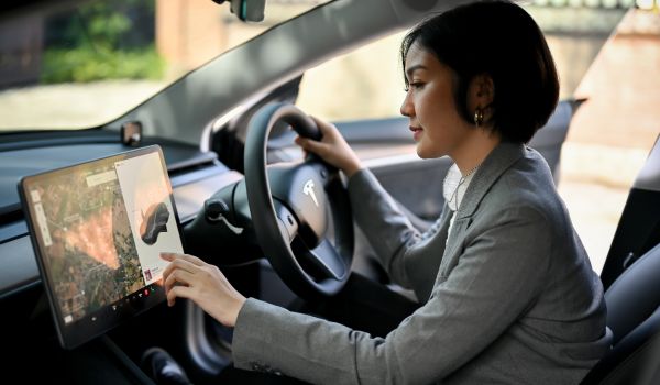 a woman inside a tesla car