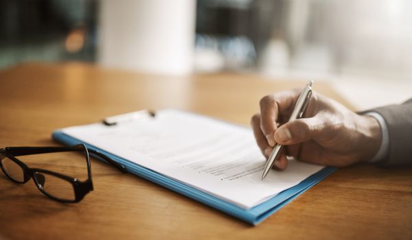 Lawyer hand showing agreement contract paperwork