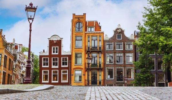 a row of traditional dutch townhouses in Amsterdam