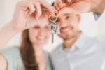 a Couple who just boughta home holding their keys