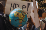 A sad globe at a climate change rally