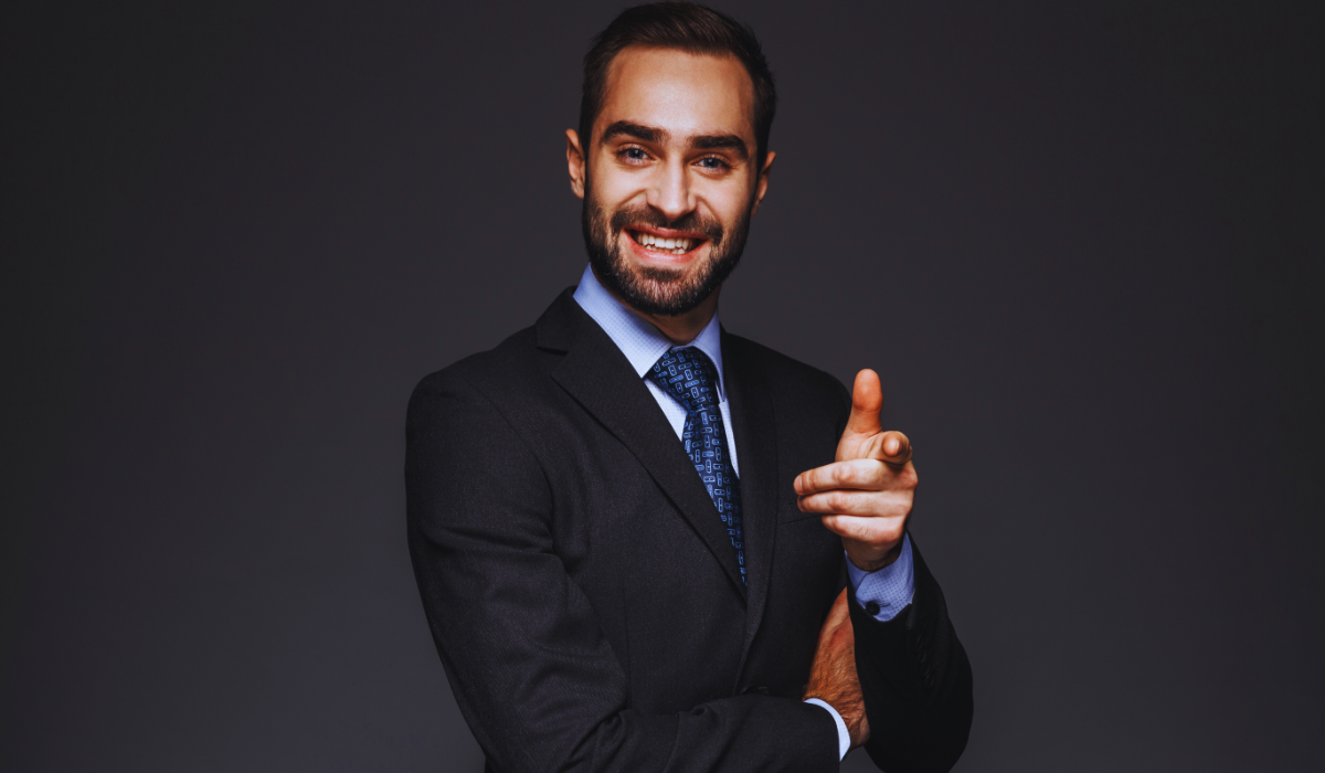 a businessman pointing in a forward direction