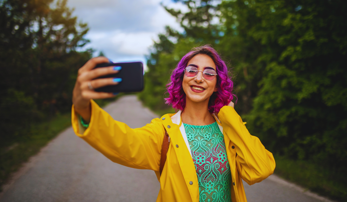 Female travel social media influencer taking a selfie