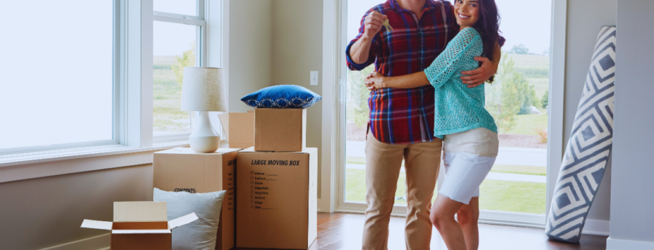 a couple of proud homeowners in their new home
