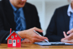 A realty lender and client signing an agreement