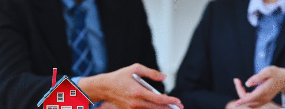 A realty lender and client signing an agreement