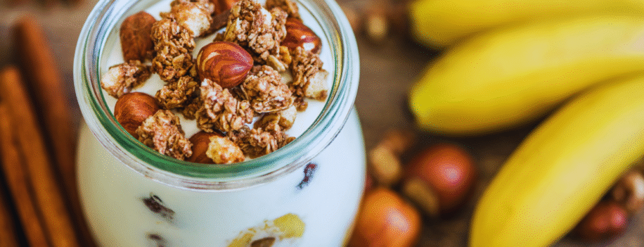 Dutch breakfast of yoghurt and muesli with nuts and banana