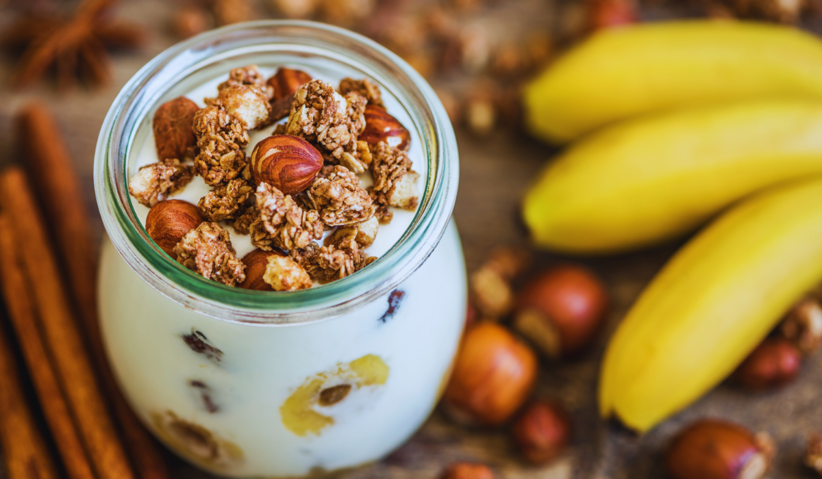 Dutch breakfast of yoghurt and muesli with nuts and banana