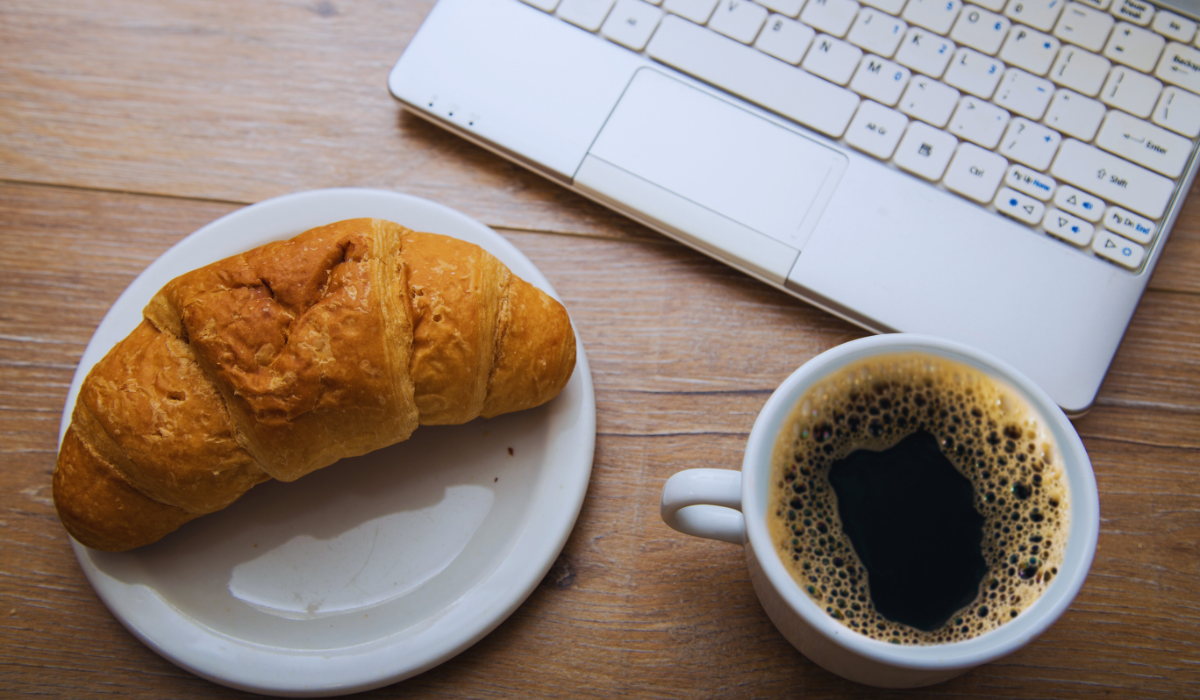 A quick dutch breakfast of croissant and black coffee