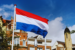 The Flag of the Netherlands against Dutch building tops