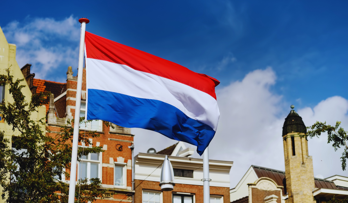 The Flag of the Netherlands against Dutch building tops