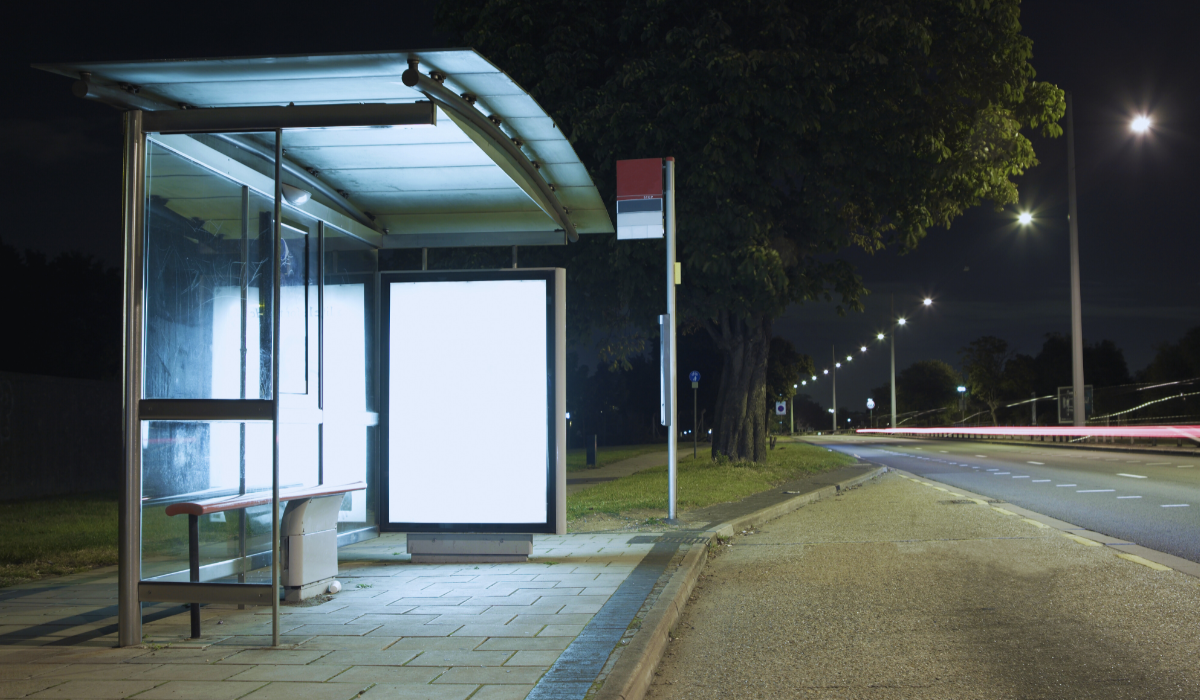 An empty bus stop at night