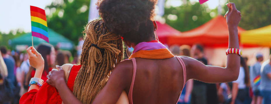 Interracial female couple at a pride parade