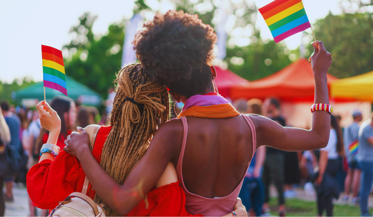 Interracial female couple at a pride parade