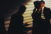 Two businessmen speaking in secret