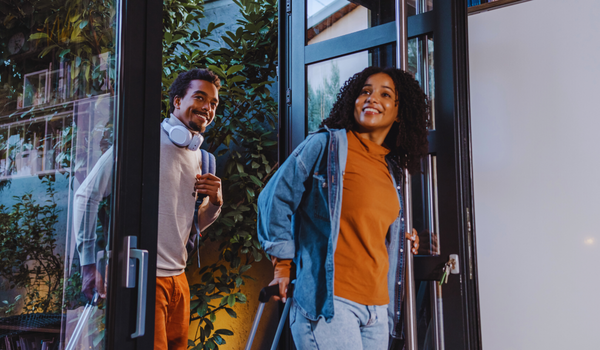 A couple walking into their vacation rental