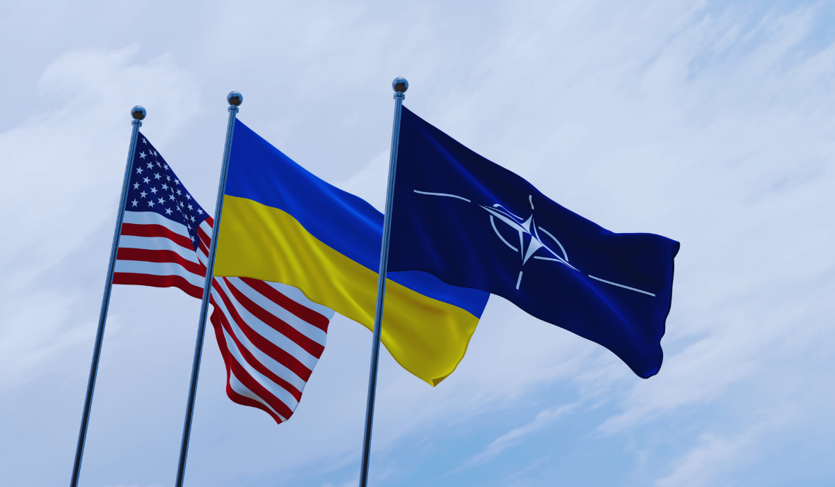 Flags of USA, Ukraine, and NATO flying in the wind