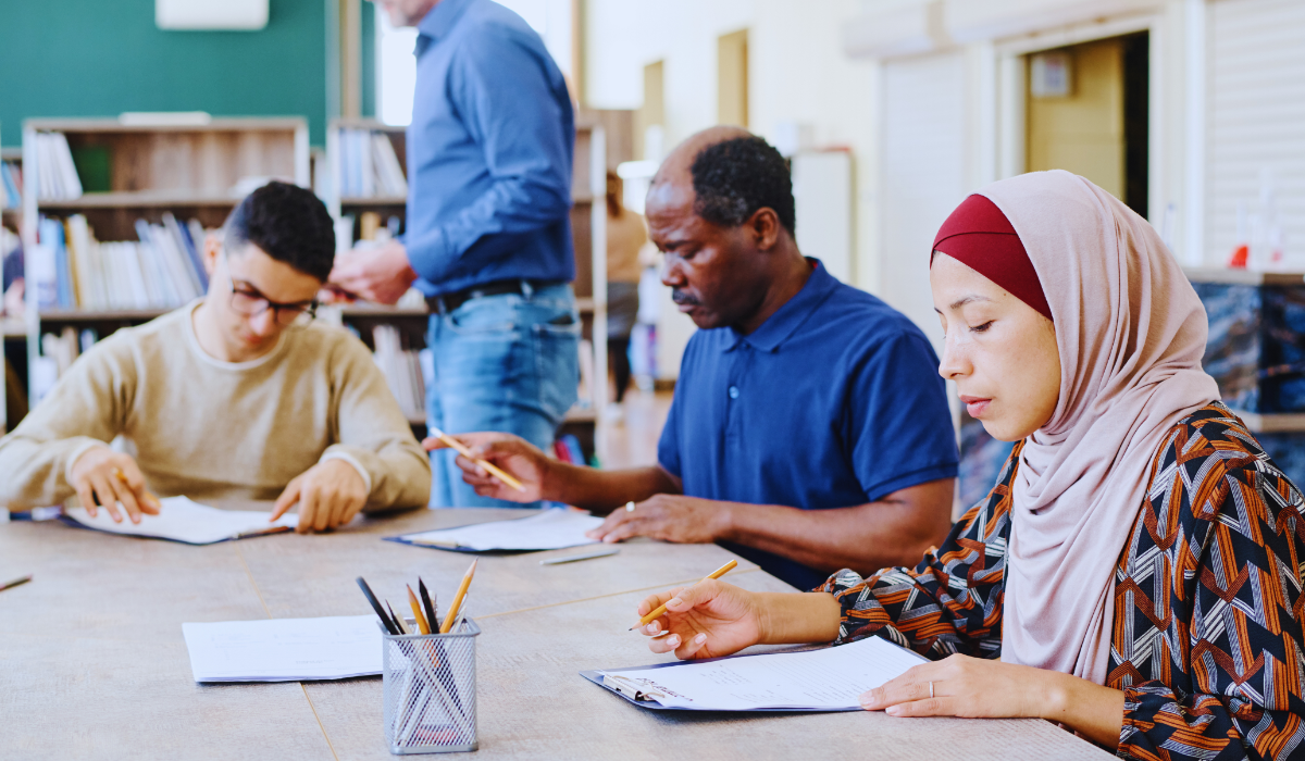 Immigrants doing the Staatsexamen/KNM NT2 integration exam in the Netherlands