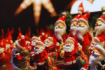 A christmas market stall with Santa Claus dolls