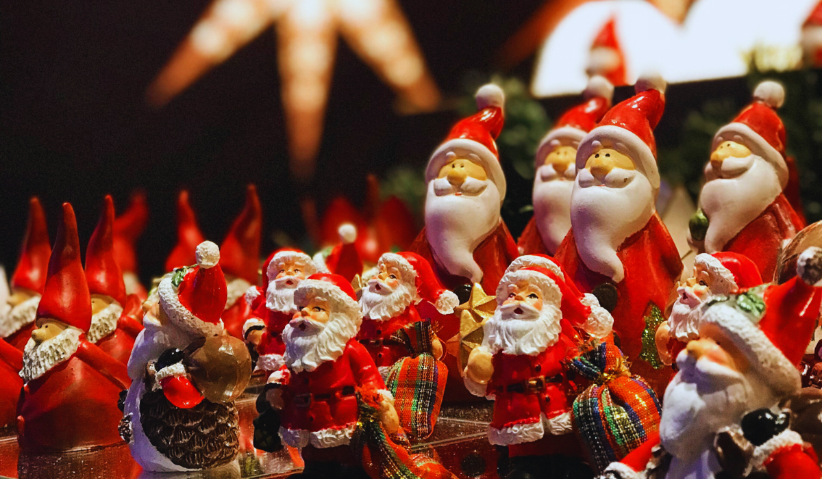 A christmas market stall with Santa Claus dolls