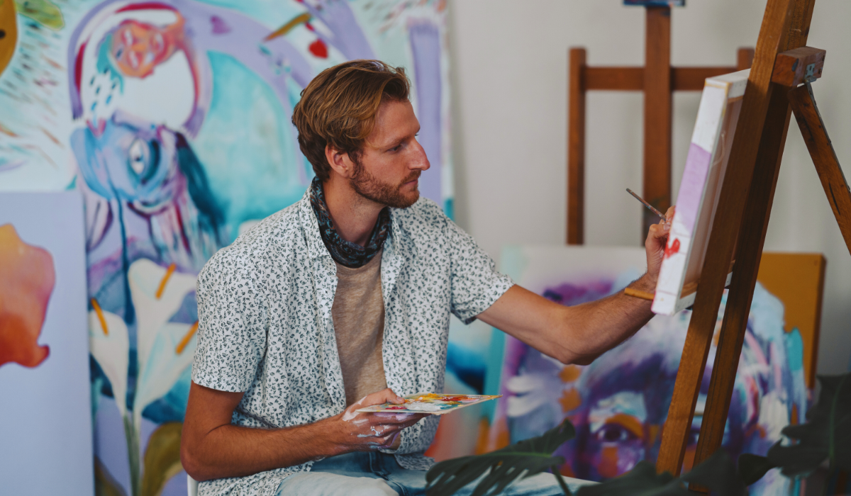 A Dutch Artist painting on a canvas holding a color palette
