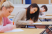 Two students taking the knm exam questions