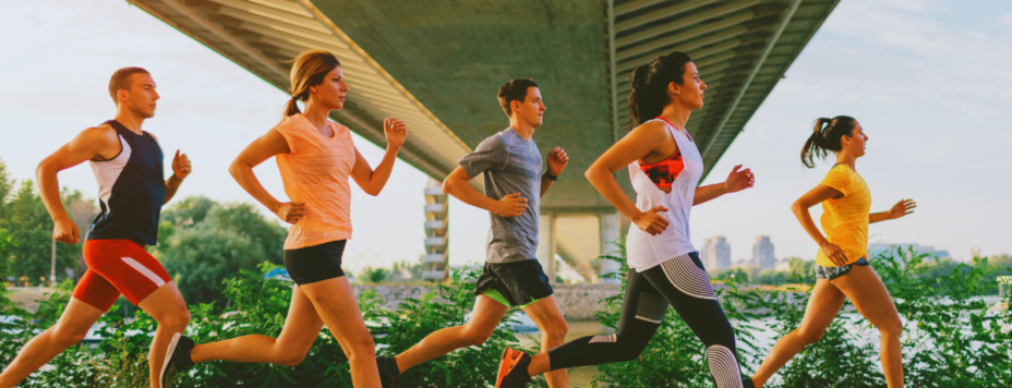 Members of a running club in the Netherlands running under a bridge