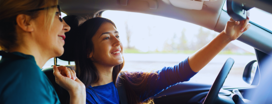 A teenage girl in a car during her driving license test