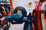 Closeup of a Dutch petrol pump filling up a small car