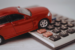 Red toy car on calculator illustrating auto financing and costs